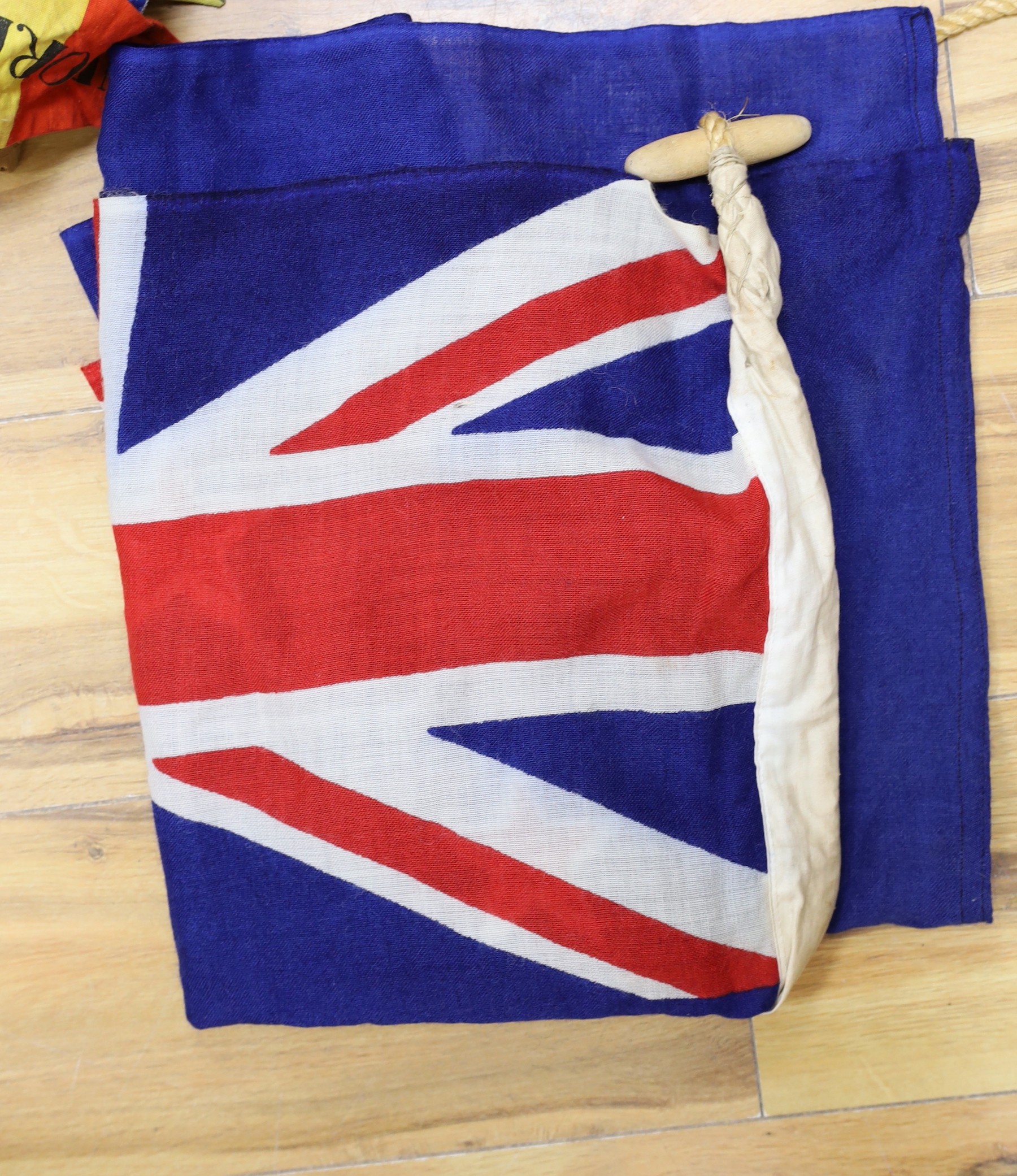 A mixed collection of flags and bunting to include the Union Jack and the star spangled banner